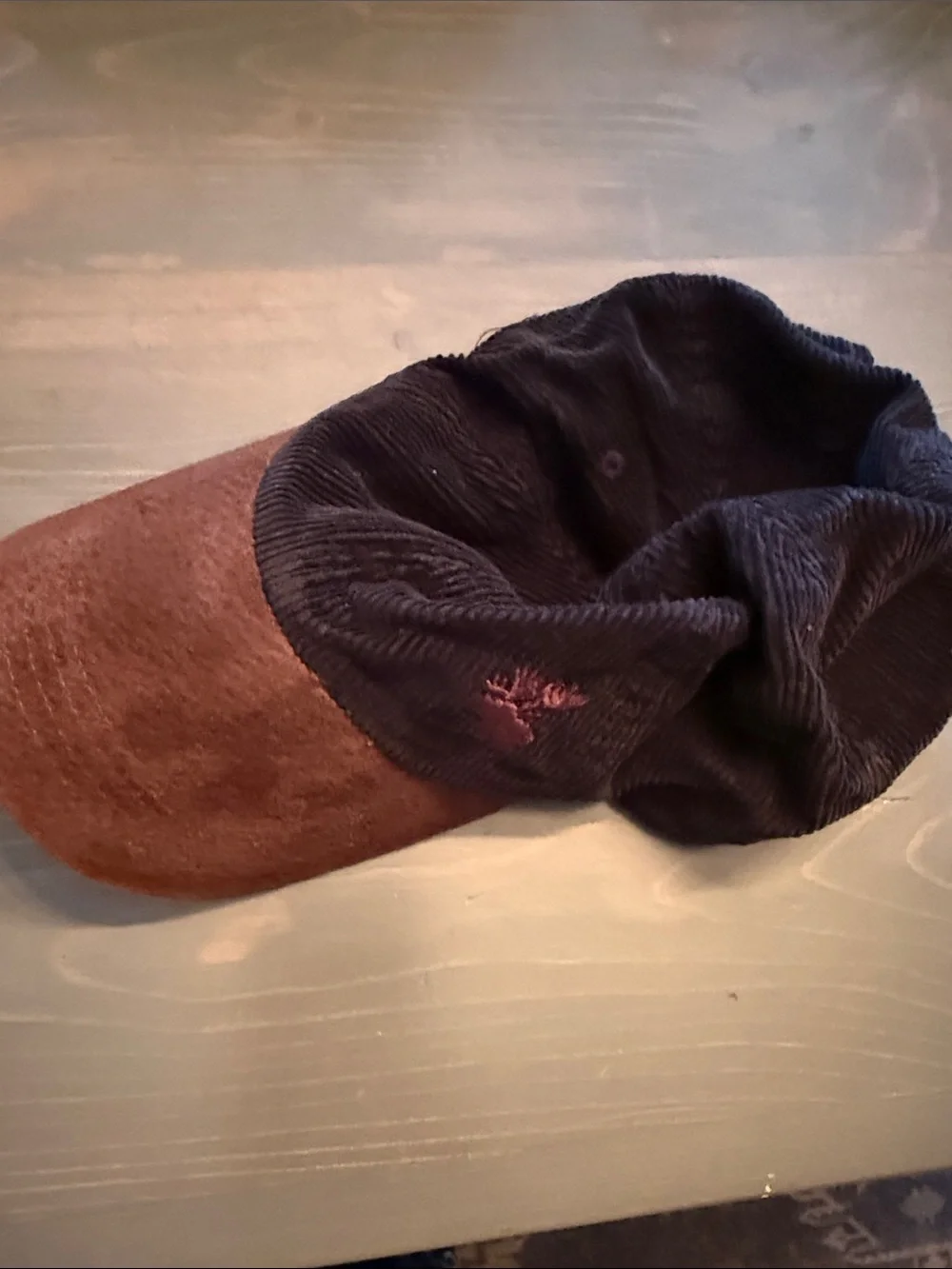 Brown Suede Visor with Black Corduroy Band and embroidered moose on left front